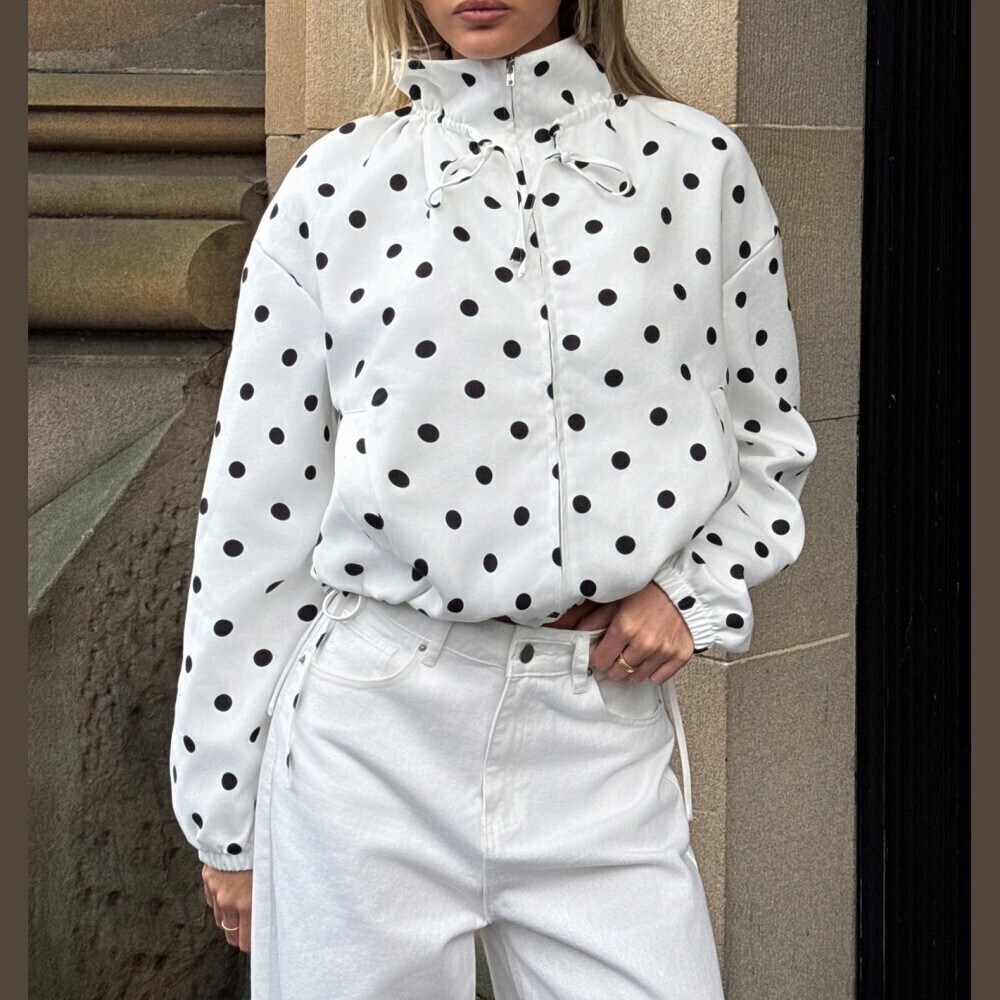 White / Black Polka Dot Tie Neck Zip Front Long Sleeve Cinched Cropped Jacket